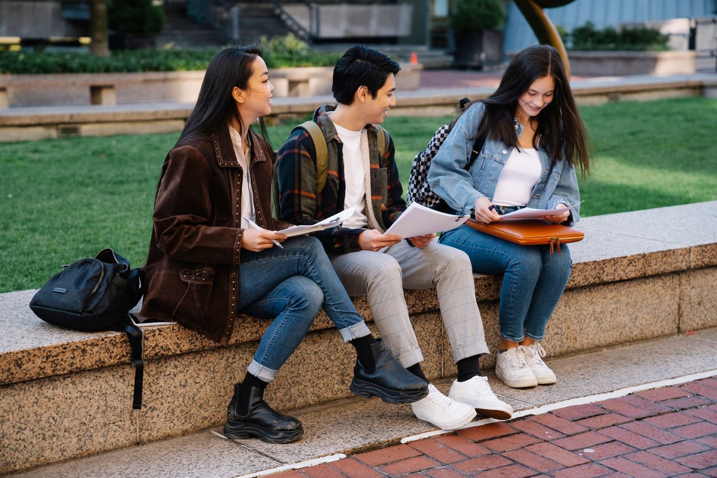 Two students working through material on a bench