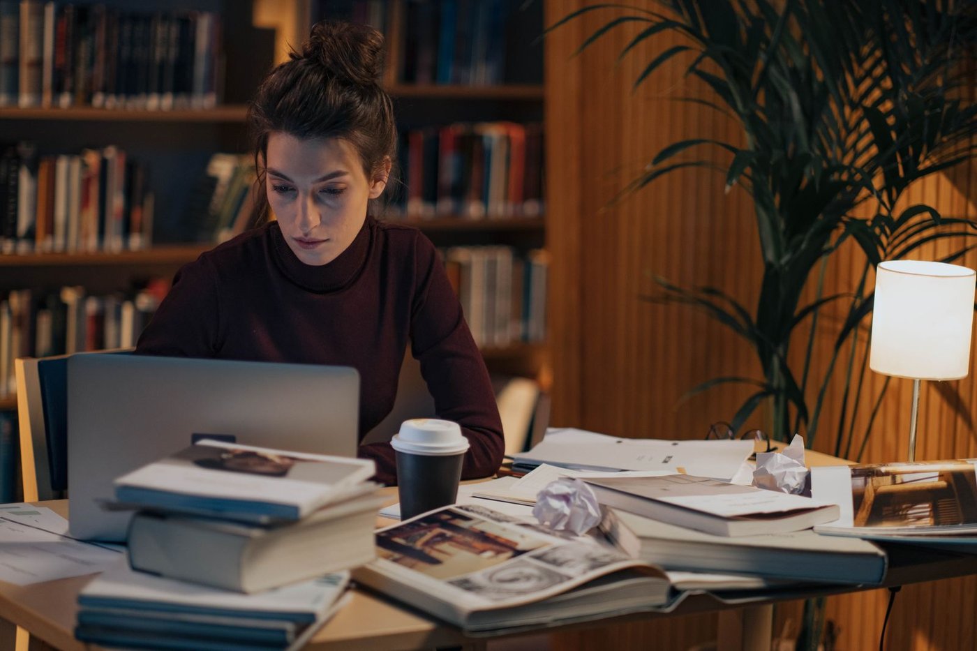 Reading course material at a desk
