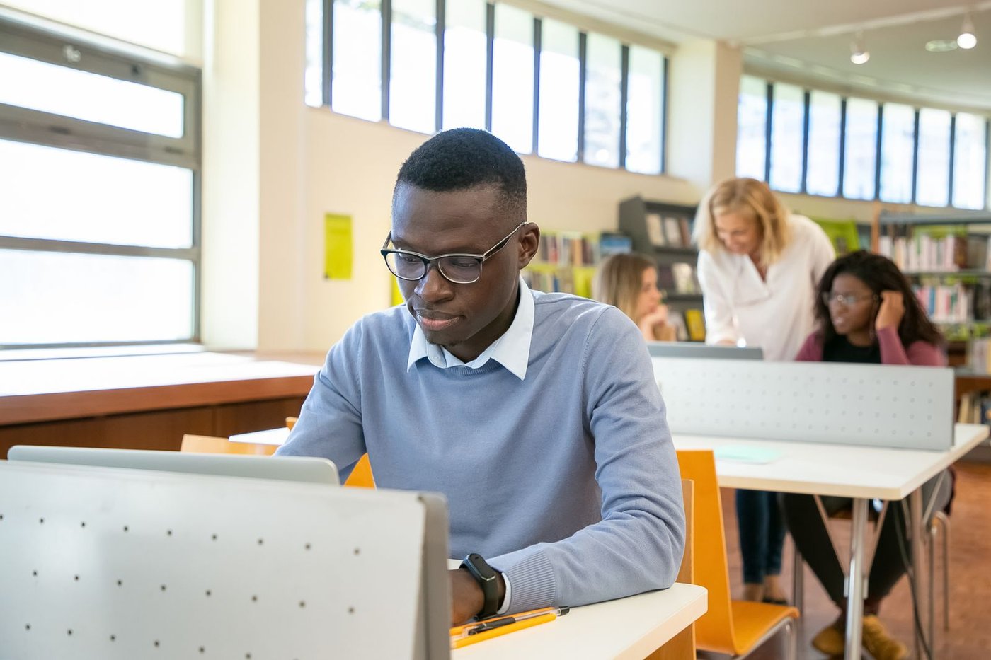 Learner writing a study plan in a notebook
