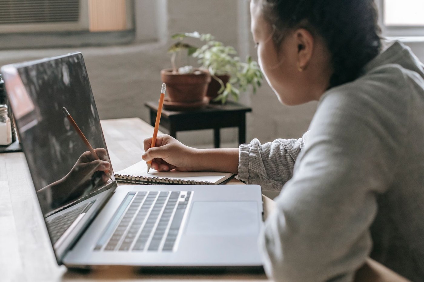 Learner working through an online course on a laptop